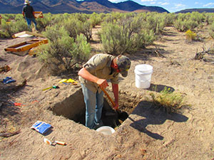 Anthropology PhD student Erik Martin excavating in Grass Valley, Nevada. Archaeological materials are preserved below the surface from the time when the area was a lake beach.