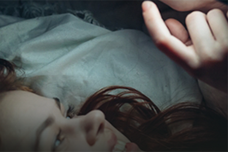 Woman on phone at night in bed